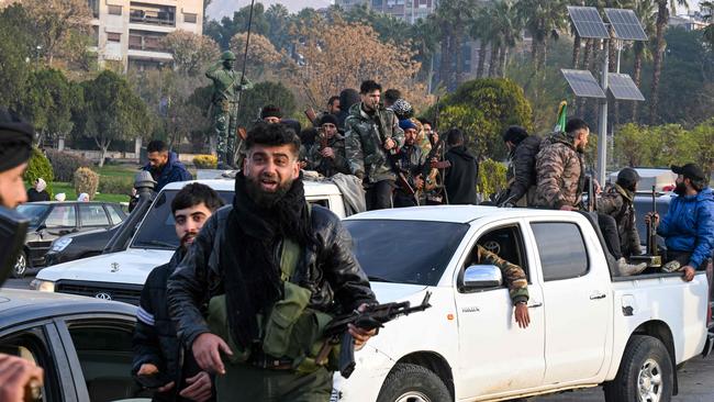 Anti-government fighters gather at Umayyad Square. Picture: Louai Beshara/AFP