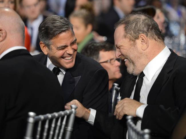 Actor George Clooney and producer Harvey Weinstein attend the Critics' Choice Movie Awards in 2013. Picture: Michael Kovac/WireImage