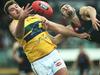 29/08/15 - Norwood v Eagles at Coopers' Stadium in Norwood. Eagles' Michael Wundke and Norwood's Alexis Greorgiou compete for the ball. Photo Tom Huntley