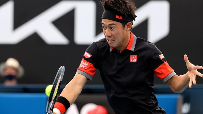 Japan's Kei Nishikori hits a return against Spain's Pablo Carreno Busta in Melbourne on Monday. Picture: AFP