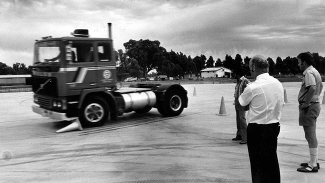 Eric Montgomery (closest to camera), in 1981. He was the director of the Goulburn Valley Driver Training complex, involved in training drivers of trucks and caravans on various road surfaces.