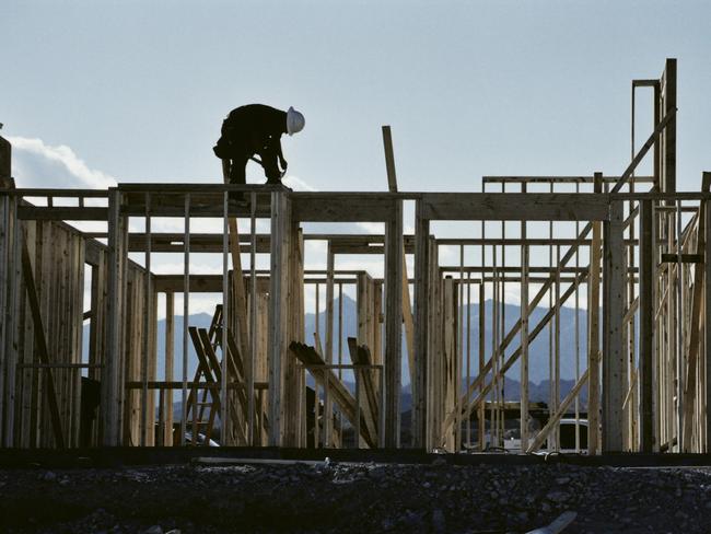 Courier-Mail, Home, Master Builders feature - November - generic Master builders piece.Worker working on the roof of a house under construction