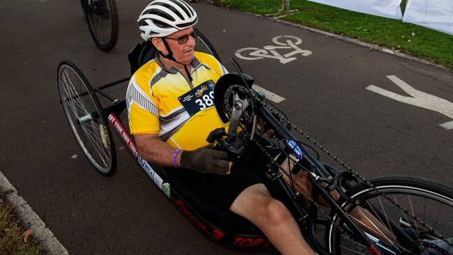 Clive Baxter rolling through the finish line after racing the 12.5km on his handcycle. Picture: Pema Tamang Pakhrin.