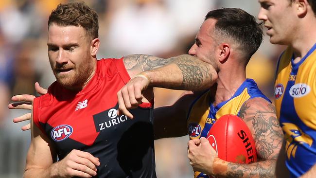 Dean Kent and Chris Masten get physical, but the Demon would have the last laugh, booting a clutch goal at the end of the fourth quarter. Picture: Getty Images