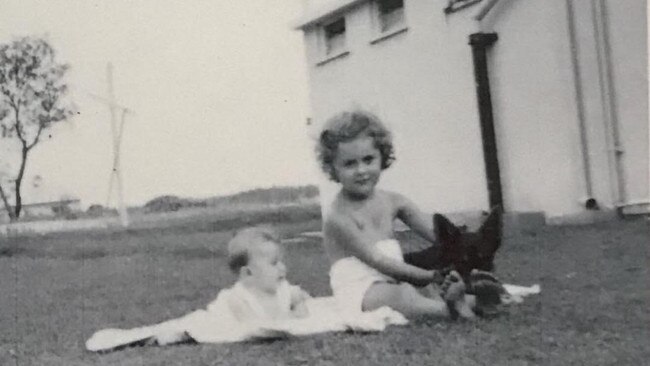 Possible picture of Matey the dog immortalised in a statue in Surfers Paradise. Linda Duckworth (left) says her parents always told them Matey was their dog who would wander off for days to Surfers Paradise where they'd find him outside the Surfers Paradise Hotel. Here is a family pic of Linda, her older sister and the possible Matey.