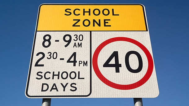 The clear, concise school speed signs you see in Sydney.