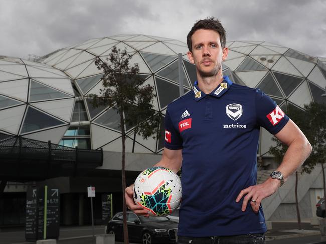 Melbourne Victory sign up Robbie Kruse poses for a photo after a press conference in Melbourne,  Thursday, July 25, 2019. (AAP Image/David Crosling) NO ARCHIVING
