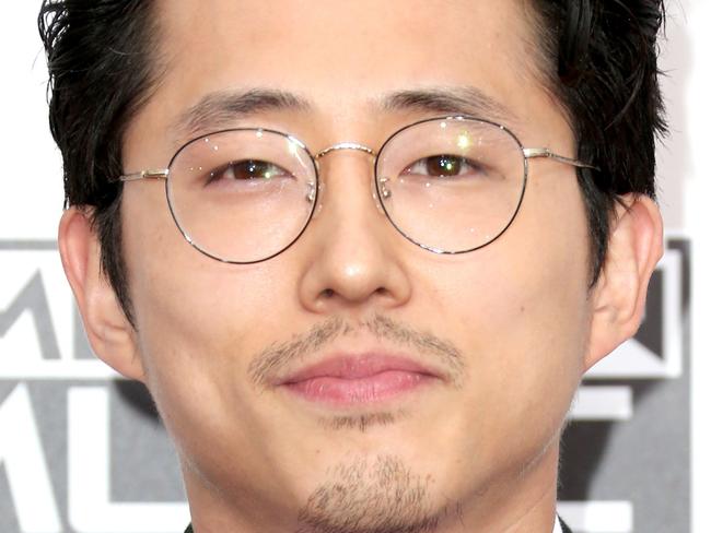 LOS ANGELES, CA - NOVEMBER 20: Actor Steven Yeun attends the 2016 American Music Awards at Microsoft Theater on November 20, 2016 in Los Angeles, California. Frederick M. Brown/Getty Images/AFP == FOR NEWSPAPERS, INTERNET, TELCOS & TELEVISION USE ONLY ==