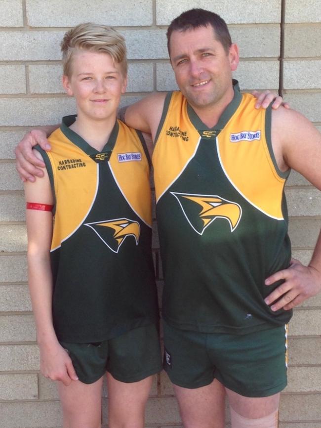 Simon Wheaton in the Dudley United footy kit with oldest son Kayne when they first played together in B grade . Picture: Supplied by Family