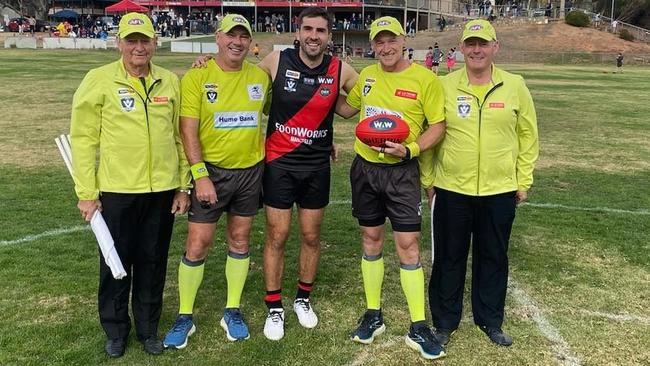 Andrew Gaff with the Ovens and King umpires before he played his first game for Bonnie Doon. Picture: Bonnie Doon Football Netball Club.
