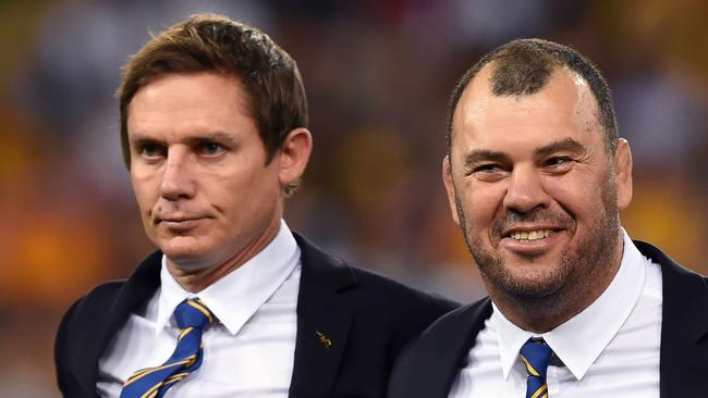 Stephen Larkham (L) could be one of the candidates to replace outgoing Wallabies coach Michael Cheika. Picture: AFP