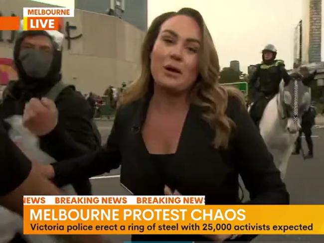 Dolling tried to push the protesters out of her way. Picture: Channel 7