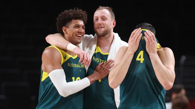 Matisse Thybulle #10, Joe Ingles #7 and Chris Goulding #4 of Team Australia