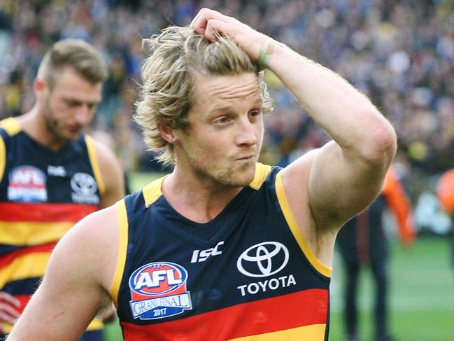 MELBOURNE, VICTORIA - SEPTEMBER 30:  Rory Sloane (L) and Taylor Walker of the Crows looks dejected after defeat during the 2017 AFL Grand Final match between the Adelaide Crows and the Richmond Tigers at Melbourne Cricket Ground on September 30, 2017 in Melbourne, Australia.  (Photo by Michael Dodge/AFL Media/Getty Images)