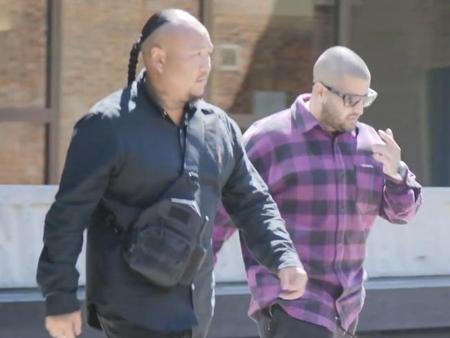 Andre Kallita leaves Parramatta District Court surrounded by a security team after finding out about a conspiracy to murder him.