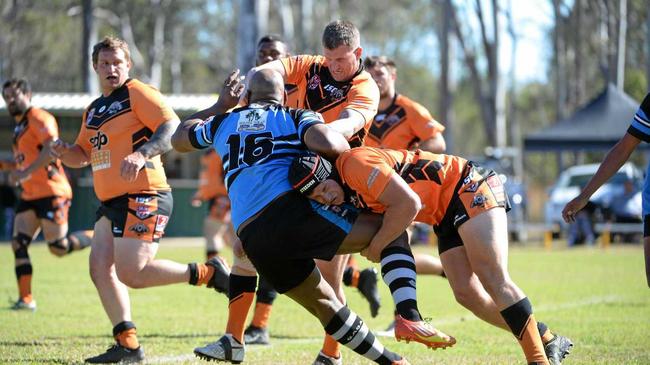 TACKLE: Serupepeli Natui is tackled down by Avondales Blake Andrew Santalucia. Picture: Brian Cassidy