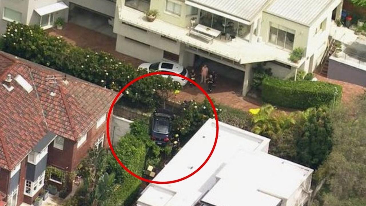 The accident saw the woman drive over a ledge and wedge her car on a street in Mosman, Sydney. Picture: Channel 9