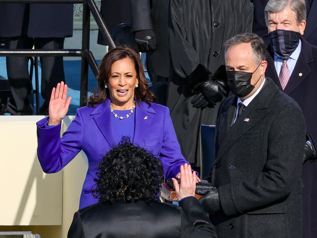 Kamala Harris is sworn as US Vice President by US Supreme Court Associate Justice Sonia Sotomayor as her husband Doug Emhoff looks on. Picture: Getty Images