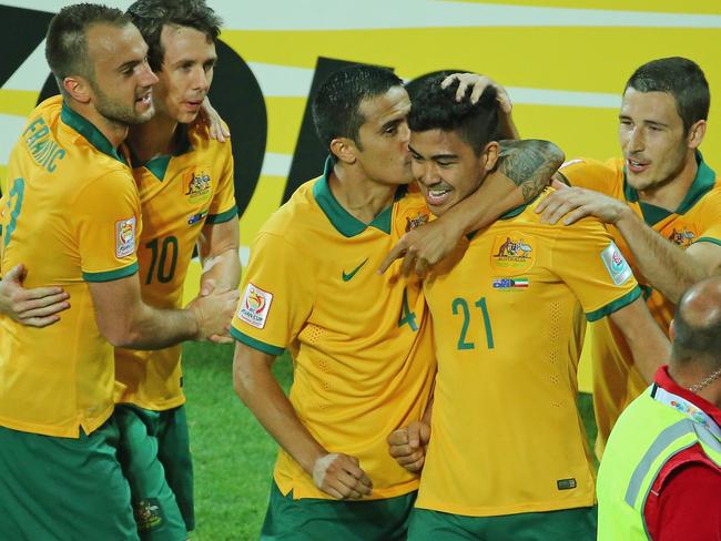 MELBOURNE, AUSTRALIA - JANUARY 09: Massimo Luongo of the Socceroos is congratulated by Tim Cahill and his teammates after scoring a goal during the 2015 Asian Cup match between the Australian Socceroos and Kuwait at AAMI Park on January 9, 2015 in Melbourne, Australia. (Photo by Scott Barbour/Getty Images)