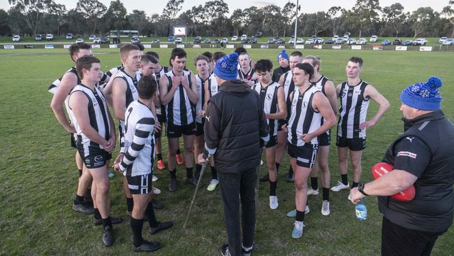 Narre Warren players have achat after the win. Picture: Valeriu Campan