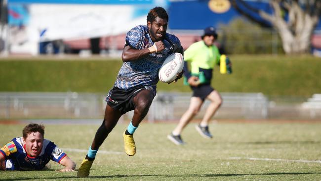 Mossman's Stanley Anau proves too quick for the Atherton defenders in the 2019 CDRL preliminary final between Mossman-Port Douglas Sharks and Atherton Roosters, held at Barlow Park, Cairns. PICTURE: BRENDAN RADKE