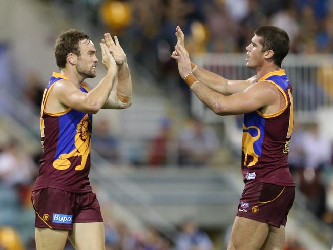 Aaron Cornelius of the Lions celebrates a goal with Jonathan Brown during the AFL match between the Brisbane Lions and the Melbourne Demons played at the Gabba. Pic Darren England.