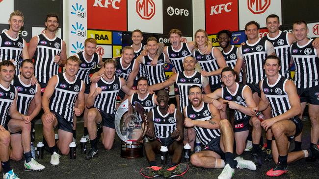 Port Adelaide celebrate their Showdown victory in the changerooms in their prison bar guernseys last year. Picture: Mark Piovesan Photography