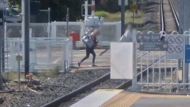 A security camera catches a person running across the tracks at Trinder Park.