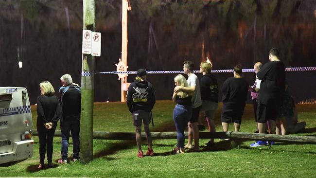 A crowd gathered to watch the ensuing drama last night. Picture: Gordon McComiskie