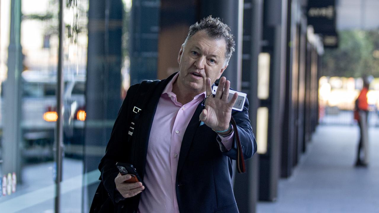 Kevin Burrowes walking to his Sydney office. Picture: Liam Mendes