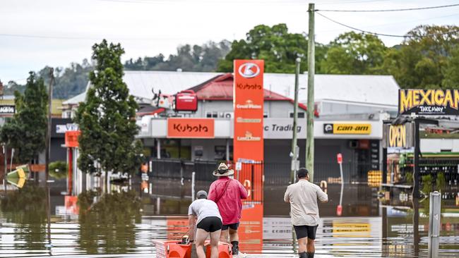 Residents examining the flooding last year. Picture: Darren Leigh Roberts.