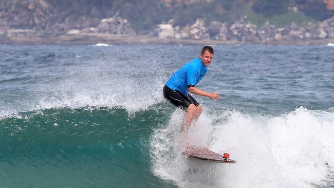 Mike Baird, who once considered a career in the clergy, is an avid surfer. Picture: Damian Shaw