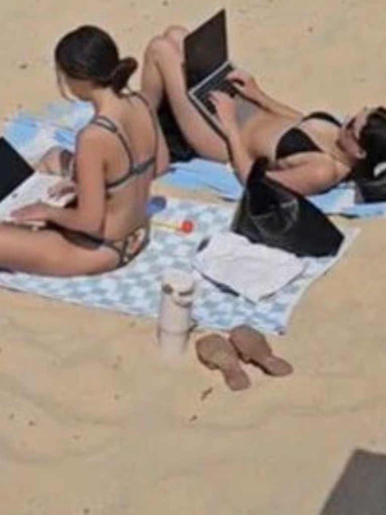 This photo of two women working from the beach recently went viral and shows just how much young people want flexibility. Picture: TikTok/laurensyesterday