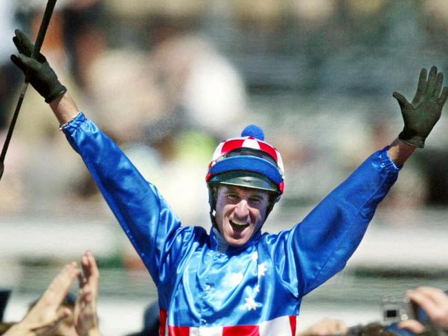 NOVEMBER 4, 2003 : Jockey Glen Boss on racehorsee Makybe Diva celebrates his Melbourne Cup victory at Flemington 04/11/03.Turf