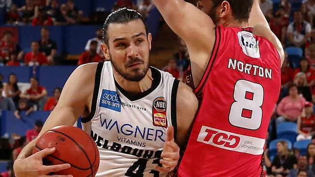 Melbourne United’s Chris Goulding and Perth Wildcat’s Mitch Norton collide on Saturday. Picture: Getty Images