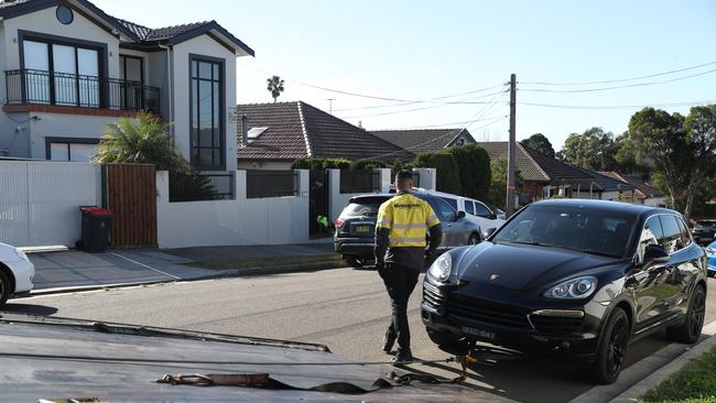 AFP police raid an Earlwood property using dogs and seizing a Porsche car. Picture: John Grainger