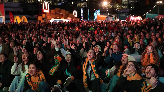 Fans At Sydney's FIFA Fan Site watch the Matildas FIFA World Cup game on Monday. It is too far to travel on Saturday night to make the kick off of the England game at Stadium Australia. Photo by Roni Bintang/Getty Images