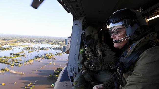 Prime Minister Scott Morrison inspects damage created by floodwaters from a helicopter during a visit to flood affected areas in Sydney. Picture: AAP