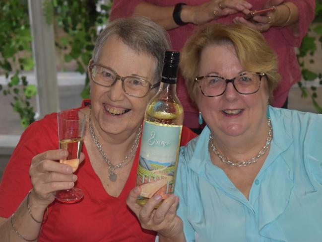 Silvana mcKain and Cindy Hall raise a glass (and bottle) at the Italian long lunch, February 25, 2024.