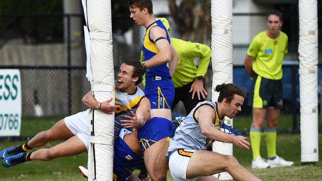 A tangle in the goalsquare at the Moodemere St end.