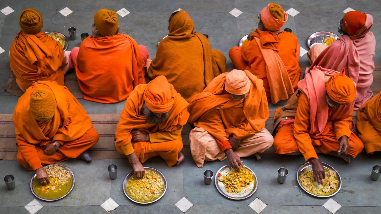 These pilgrims are attending the Kumbh Mela, the world’s largest gathering of people, on the Ganges River in India. Local ashrams offer them dhal and rice, and they enter the building calmly and silently to consume their meal. Picture: Sue O'Connell/Pink Lady® Food Photographer of the Year