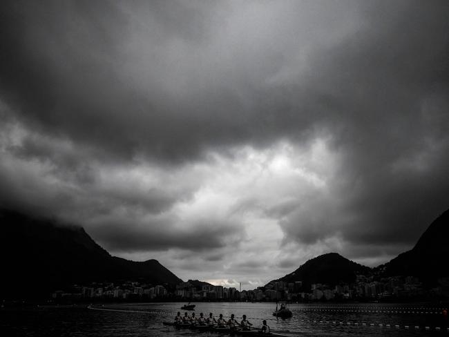 Rowers warm up at the Lagoa Rodrigo de Freitas ahead of their race at the Rio 2016 Olympic Games in Rio de Janeiro on August 8, 2016. Jeff PACHOUD / AFP / AFP PHOTO / JEFF PACHOUD