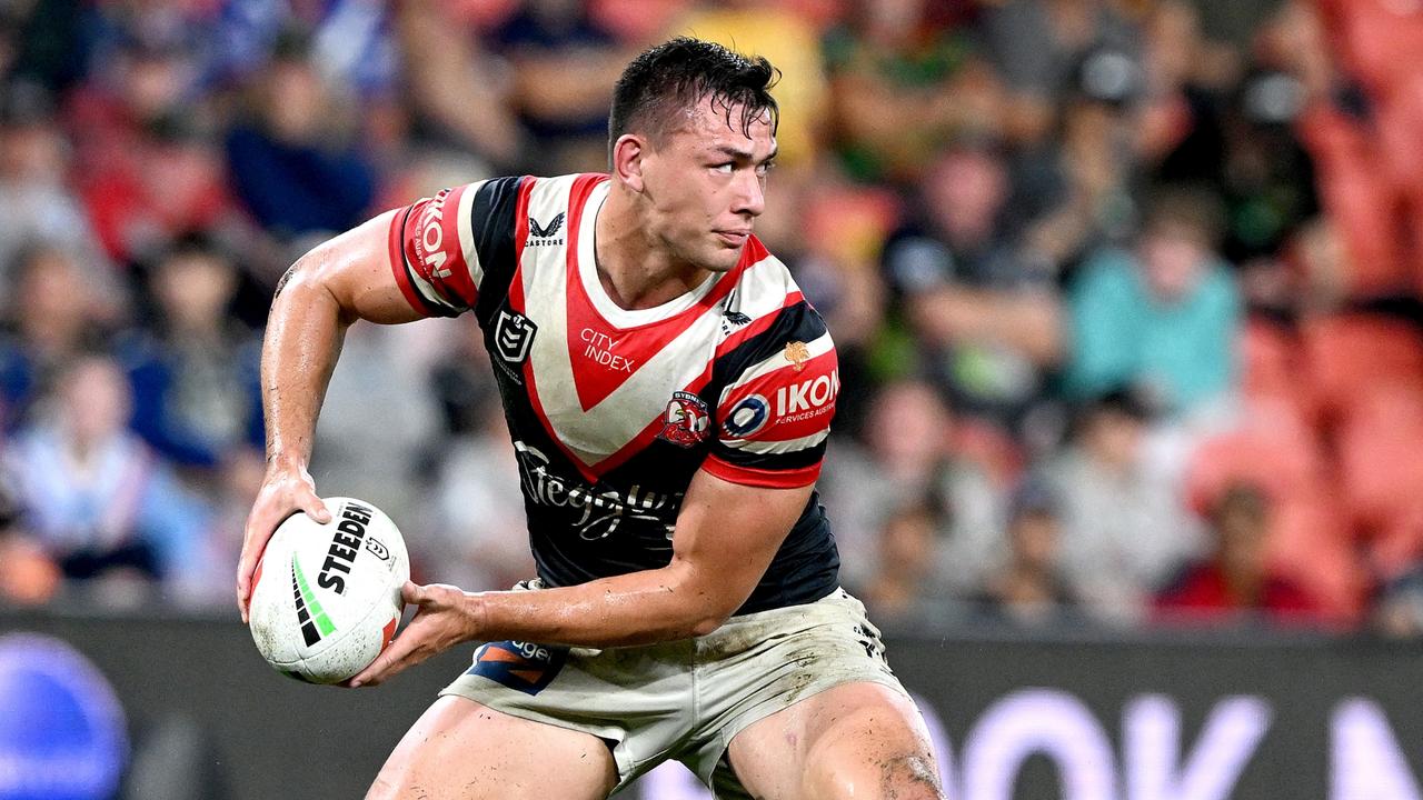 BRISBANE, AUSTRALIA - MAY 07: Joseph Manu of the Roosters passes the ball during the round 10 NRL match between Sydney Roosters and North Queensland Cowboys at Suncorp Stadium on May 07, 2023 in Brisbane, Australia. (Photo by Bradley Kanaris/Getty Images)