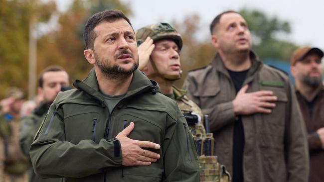 Ukrainian president Volodymyr Zelensky taking part in the state's flag raising in the de-occupied city of Izyum, Kharkiv region on September 14, 2022. Picture: UKRAINIAN PRESIDENTIAL PRESS SERVICE / AFP.