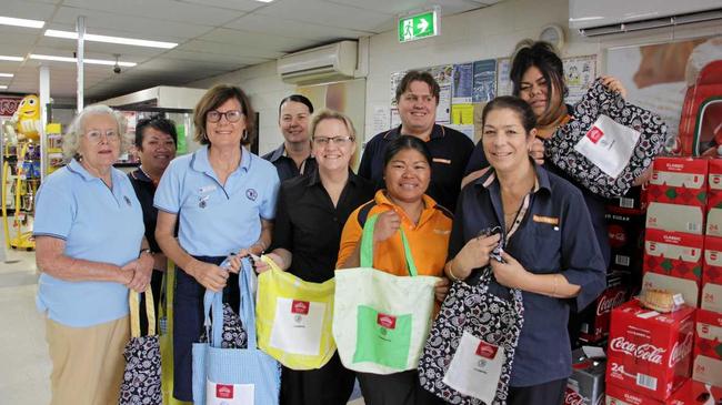 GOING GREEN: Condamine-Arubial QCWA members donate hand-crafted 'Boomerang Bags' to two Miles stores. Picture: Contributed