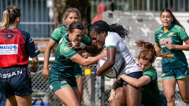 Rugby Sevens player Edie Burke, right, tackling an opponent. Picture: Supplied