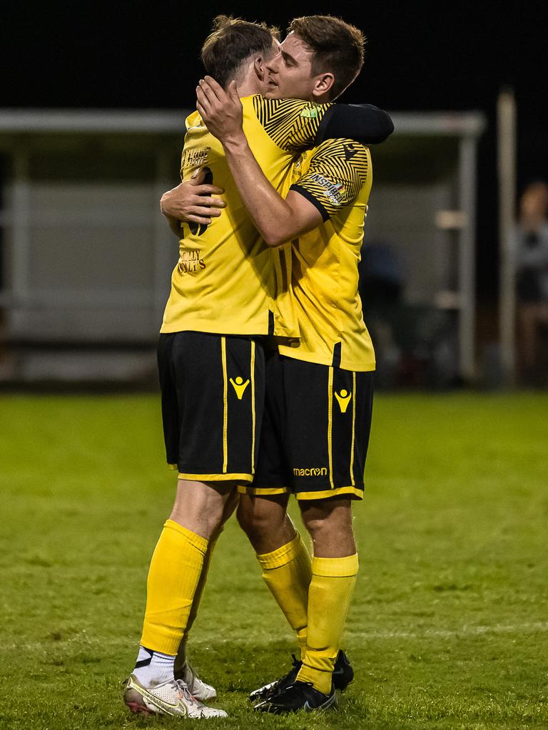 Edge Hill United's Crios O'Hare (left) and Joshua Taylor embrace after Edge Hill United won the FNQ Premier League Grand final between Edge Hill United and Leichhardt at Endeavour Park. Picture: Emily Barker