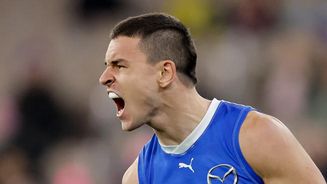 MELBOURNE, AUSTRALIA - JUNE 22: Luke Davies-Uniacke of the Kangaroos celebrates a goal during the 2024 AFL Round 15 match between the Melbourne Demons and the North Melbourne Kangaroos at The Melbourne Cricket Ground on June 22, 2024 in Melbourne, Australia. (Photo by Dylan Burns/AFL Photos via Getty Images)