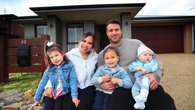 Evonne and Daniel Calyk with their children Georgia (4), Micah (2), and Nate (4 months), outside their home, which is on the market in Officer. Picture: Rebecca Michael
