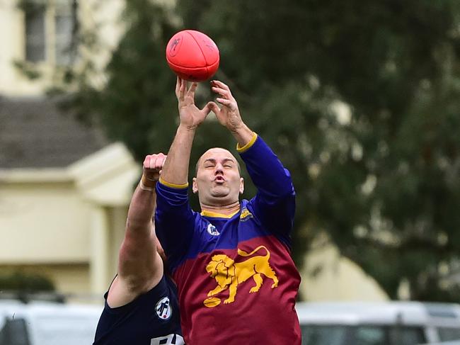 NFL footy: Epping V South Morang. Paul Harrison Sth Morang marks in front of Epping's Michael Robertson.